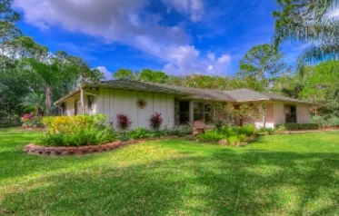 Lovely residence surrounded by gorgeous gardens.